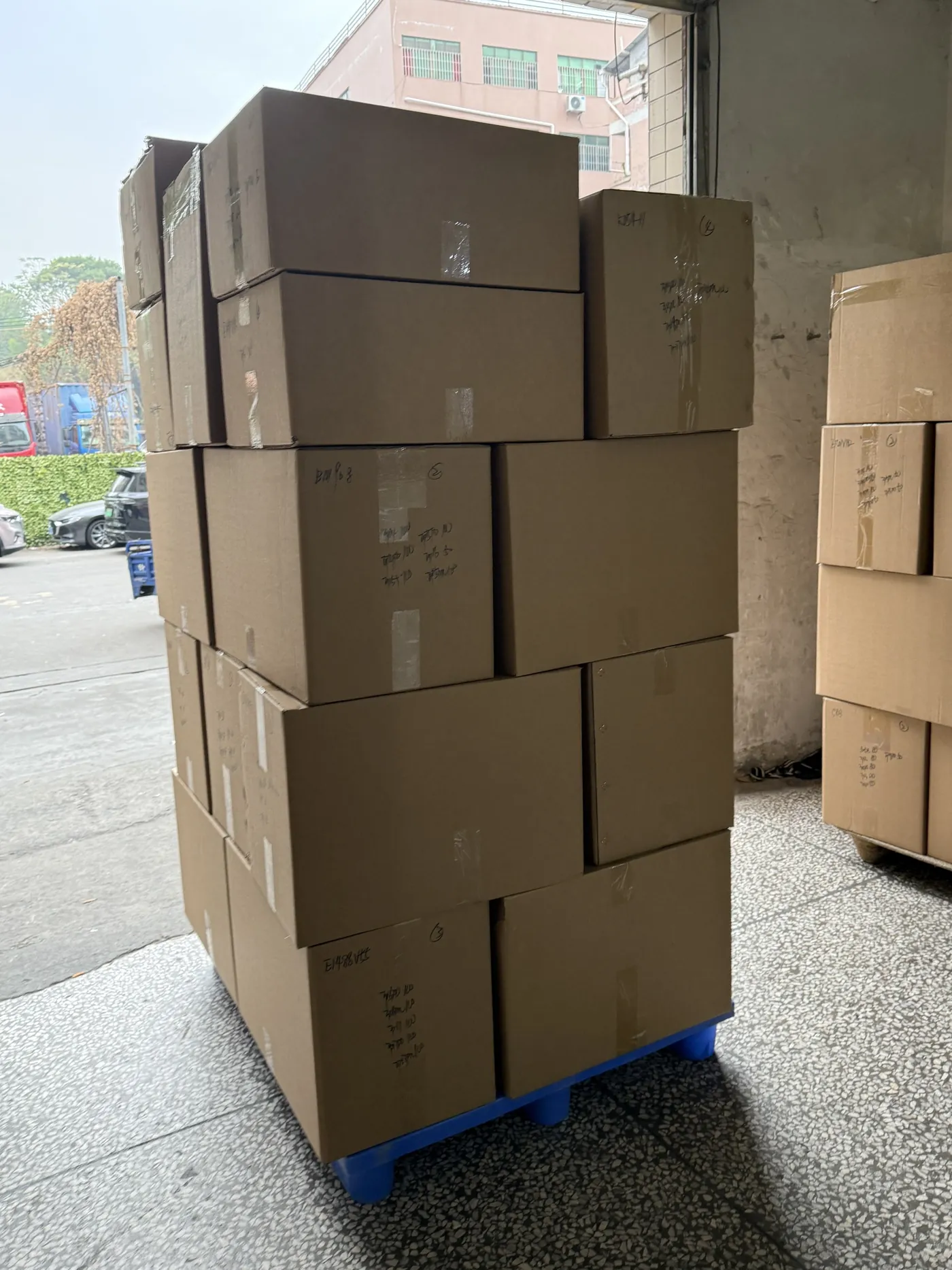 Cartons stacked on a warehouse trolley before dispatch review